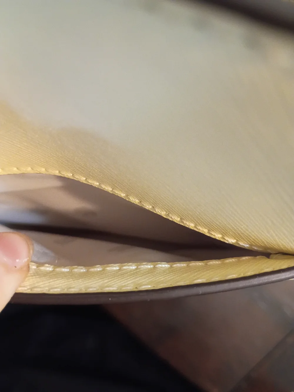 Kate Spade Staci Medium Satchel in a light yellow colorway.
